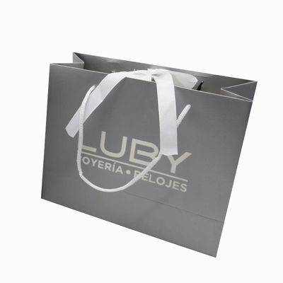 Estampado caliente Bolsas de regalo de lujo personalizadas Bolsas de compras Kraft reciclables con asas