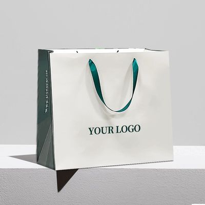 Bolsas de papel Kraft biodegradables con mangos exquisitos de regalo Bolsas de compras al por menor