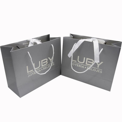 Estampado caliente Bolsas de regalo de lujo personalizadas Bolsas de compras Kraft reciclables con asas