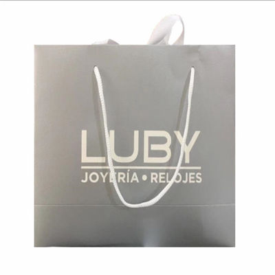 Estampado caliente Bolsas de regalo de lujo personalizadas Bolsas de compras Kraft reciclables con asas