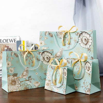 Bolsa de regalo de embalaje de compras de papel ecológico personalizada impresa con su propio logotipo