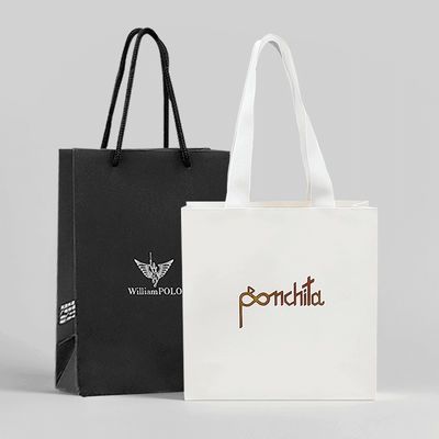 Bolsas de ropa de lujo bolsas de papel bolsas de regalo blancas con mangos de cinta